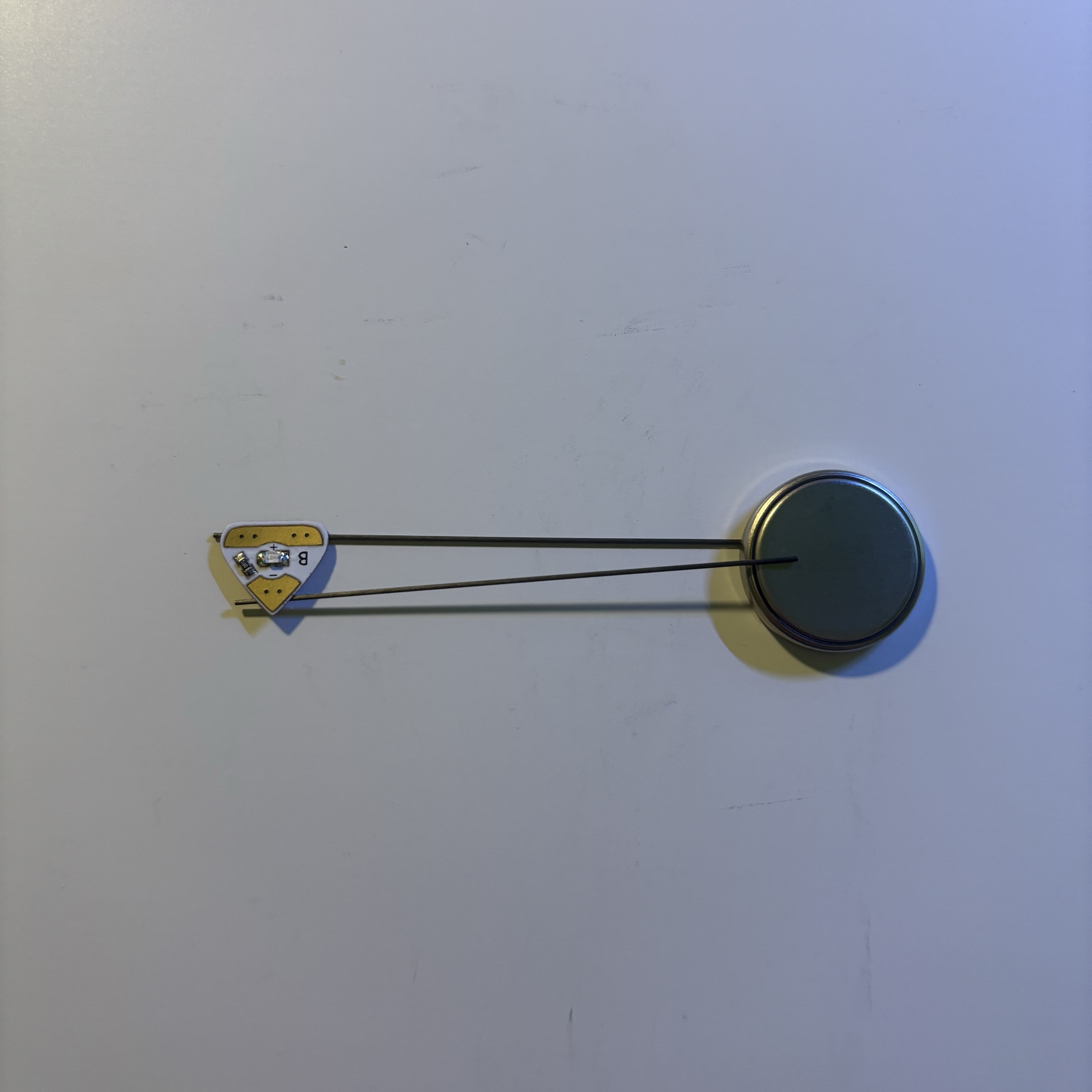 I started exploring other possible conductors. I started by using a pencil lead. However the circuit was not connected. My guesses as to why could be first, the pencil lead was too thin, making its contact surface with the battery and the LED too small to conduct electricity, and second, the pencil lead may have contained other substances that caused it not to conduct electricity.