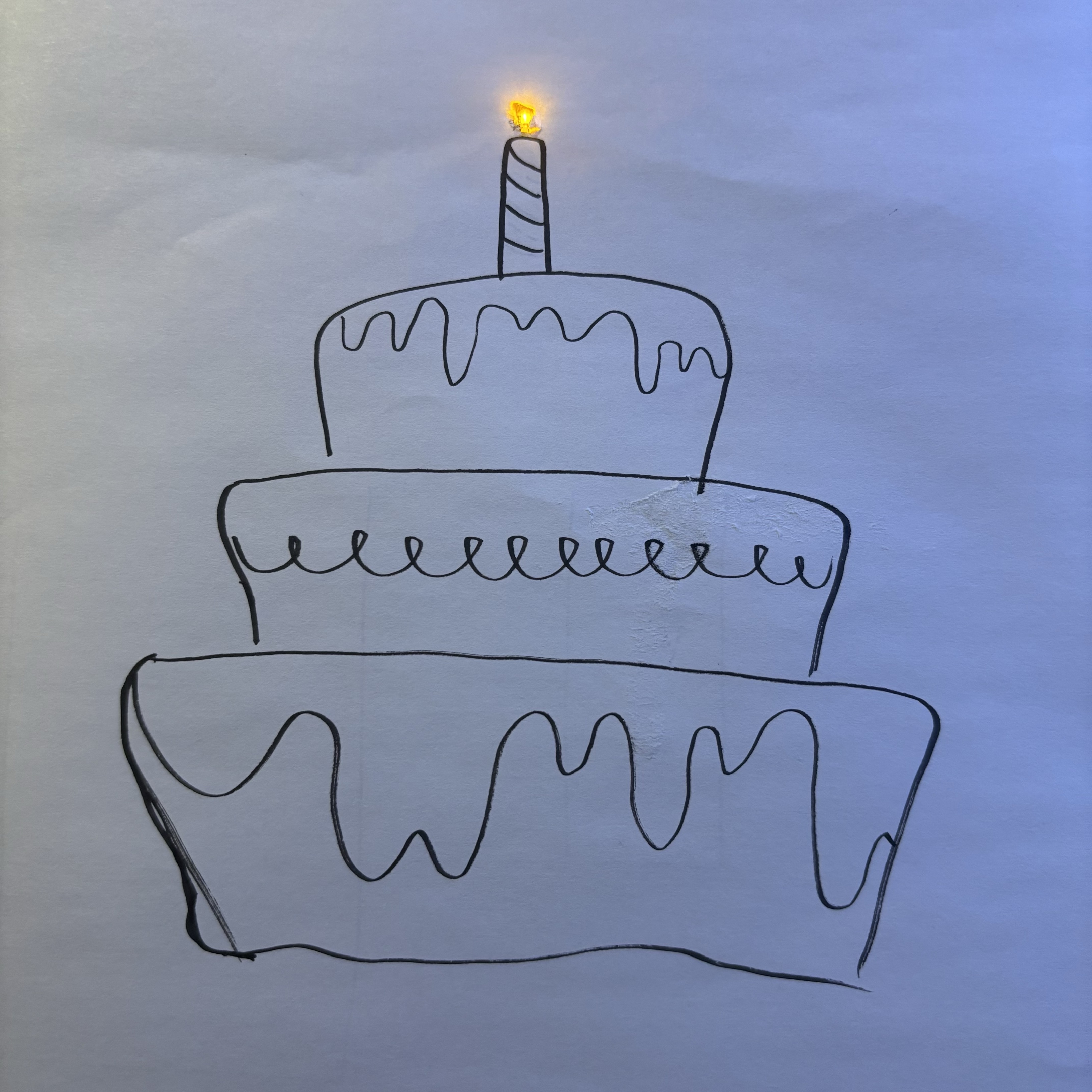 After familiarizing myself with how to use the tools to build the circuit, I tried to combine the LED with the drawing. I used yellow LED to simulate the color of the candles. I simply drew a cake with a marker to make it easier to recognize the shape of the candle.