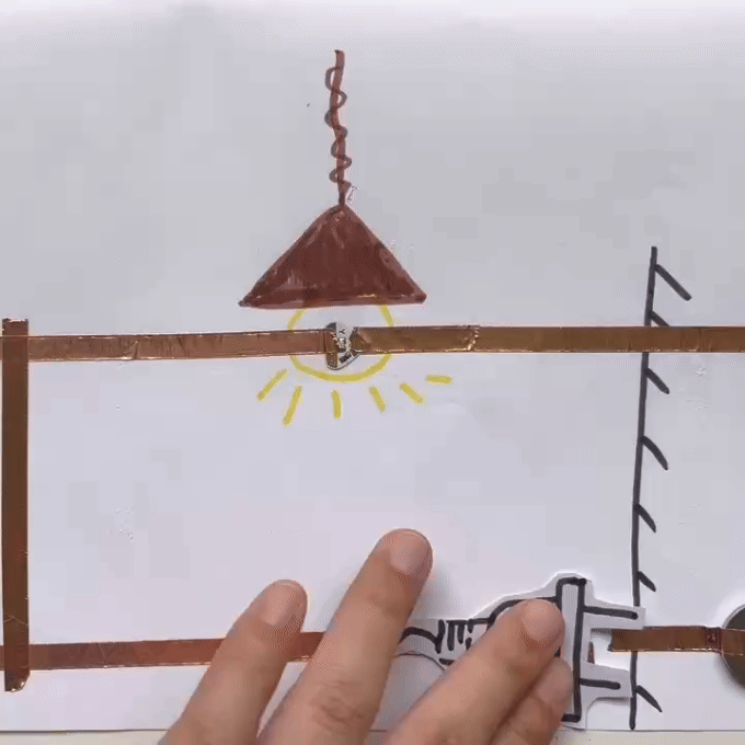 Just like the one shown in the GIF. This circuit is turned on by sliding the plug, which simulates the action of plugging in our plugs. The ceiling light comes on when it's switched on, and the copper tape that's been folded over does provide some degree of dampening.