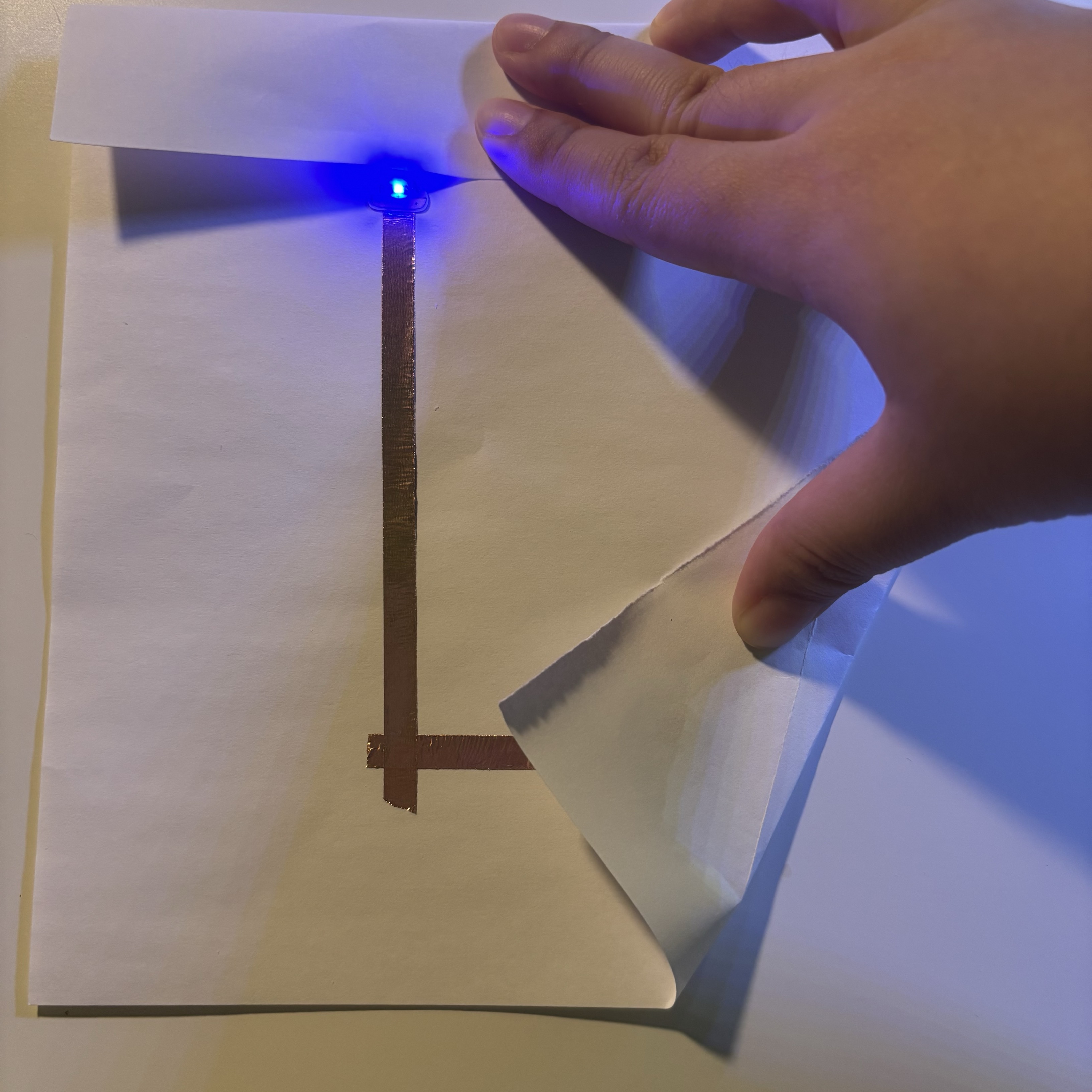 After learning the basic skills of interacting with a circuit, I built this circuit. As you can see, I disconnected two parts of the circuit and had to fold both the top part of the paper and the corner in order to connect the circuit. I think that the more disconnections there are, the more complex it becomes and the more interactive actions the user can do.