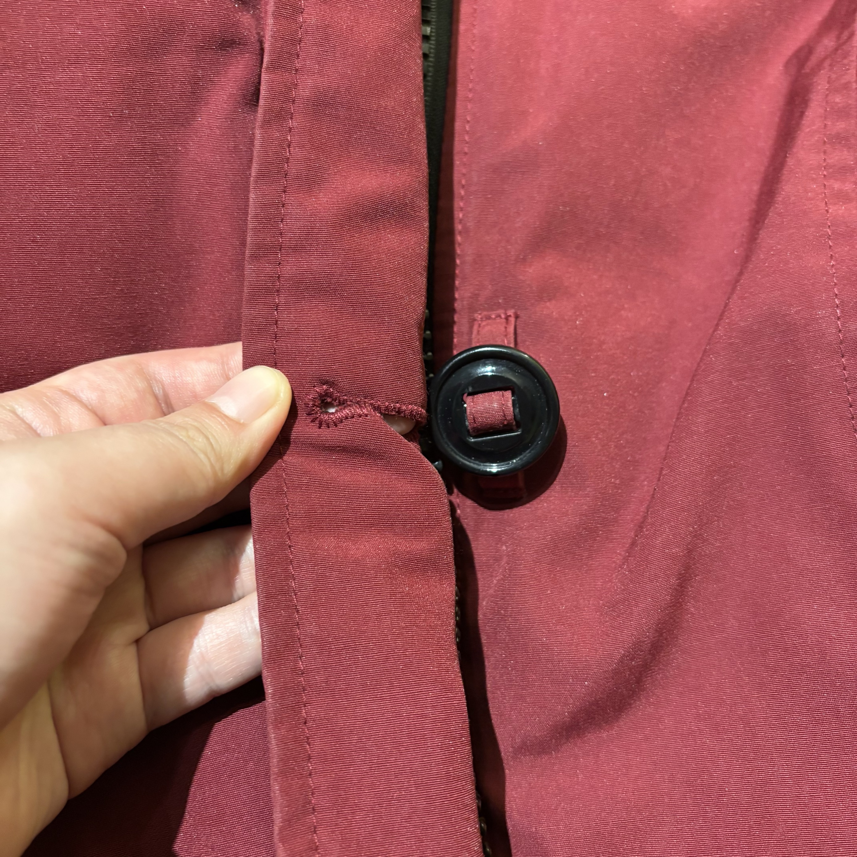 Buttoning is a classic example of clothing-based interaction. The image shows a button from my down jacket. Other types of buttons include snap buttons, toggle buttons, and duffle buttons, among others. The material and shape of buttons can also be designed and varied in many creative ways.
