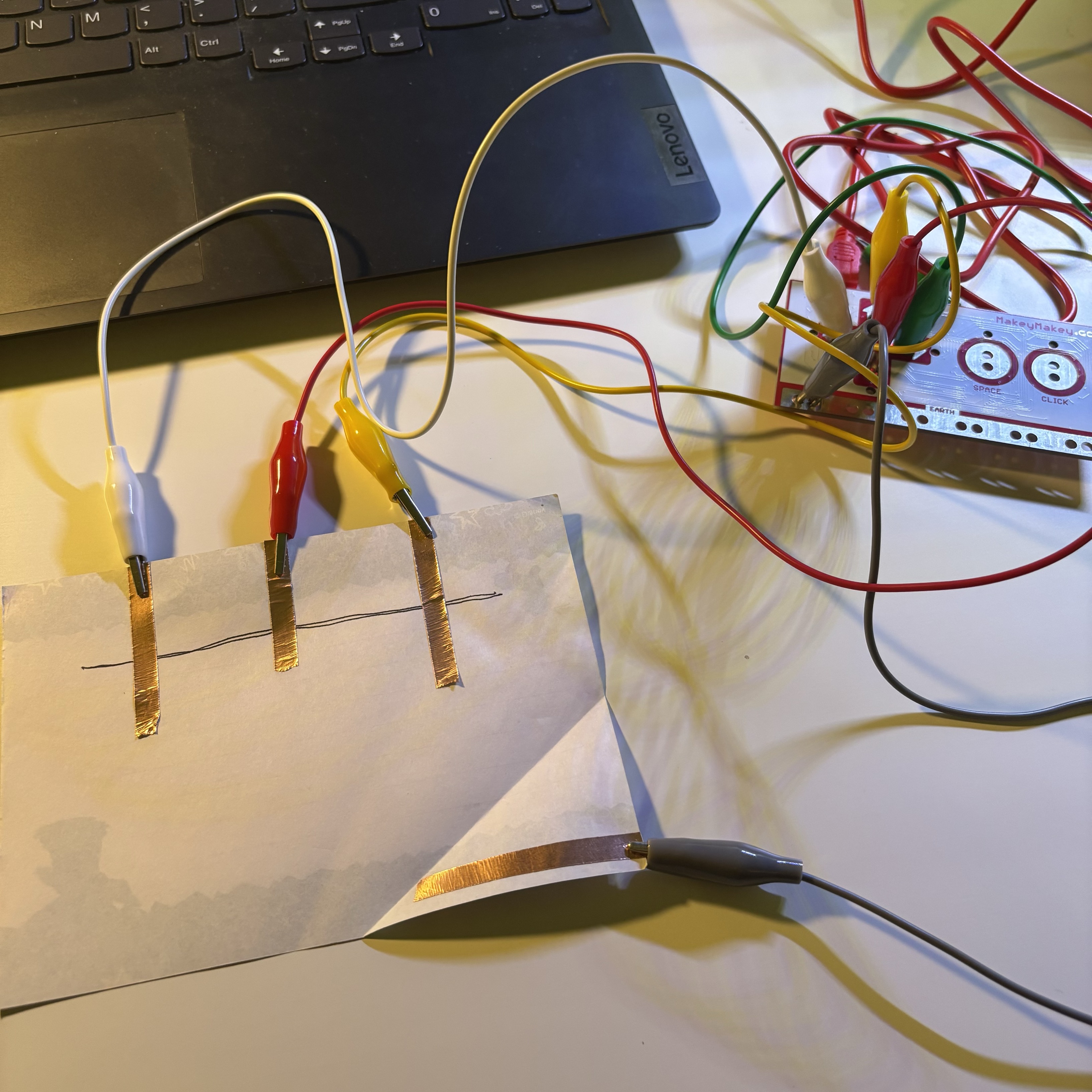 Incorporating knowledge from Project 1, I created a paper switch that triggers different keys when the paper is folded into various positions.