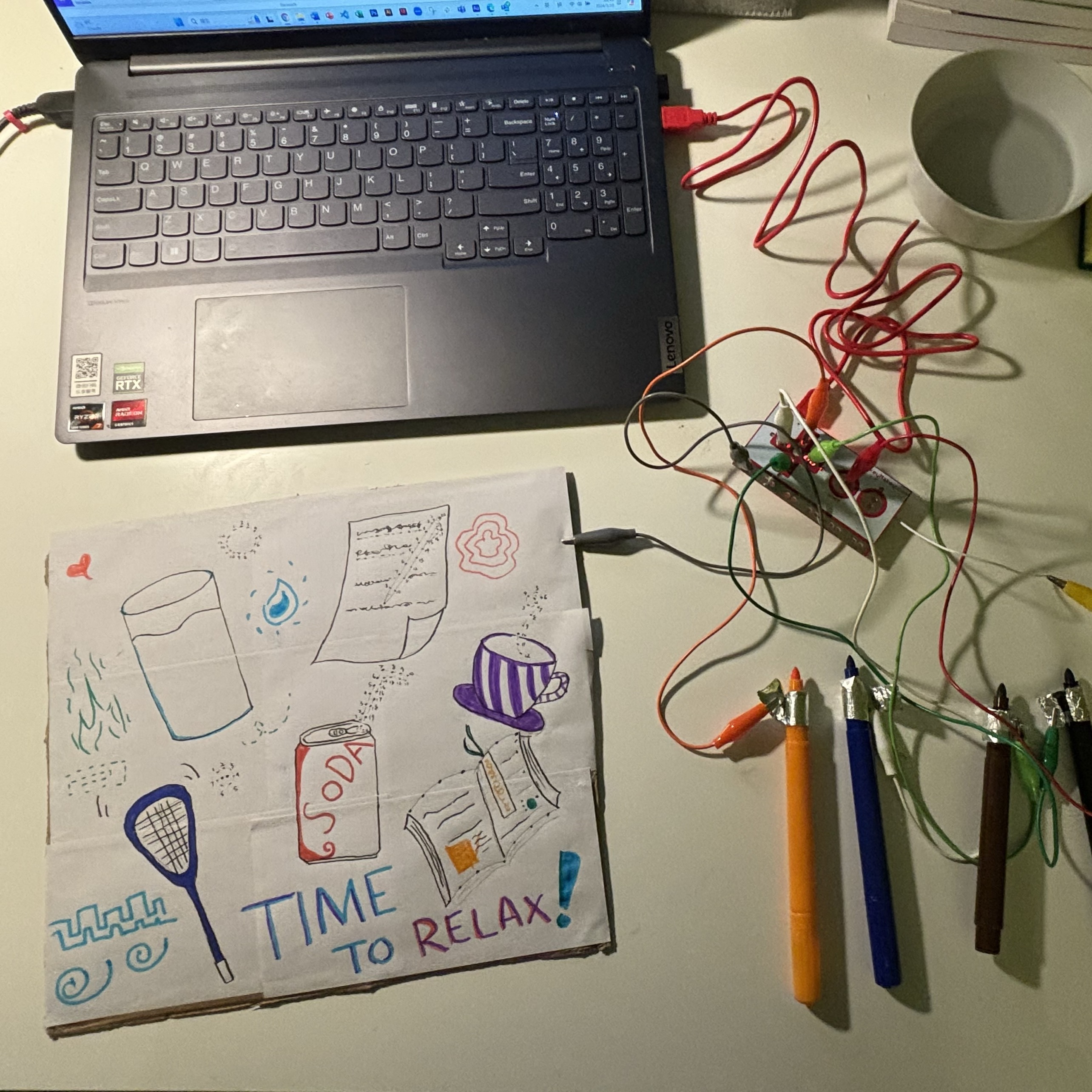 In this attempt, I drew some sound-associated objects from Project 2 on paper, moistened the paper to make it conductive, and connected it to the ground wire. I then wrapped different pens with aluminum foil and connected each to a different sound. When the foil on the pens touched the wet paper, it would trigger a sound. However, the paper couldn't be evenly moistened, which made conductivity unreliable, and the drawings would blur due to the water. So I decided to make further improvements to this experiment.