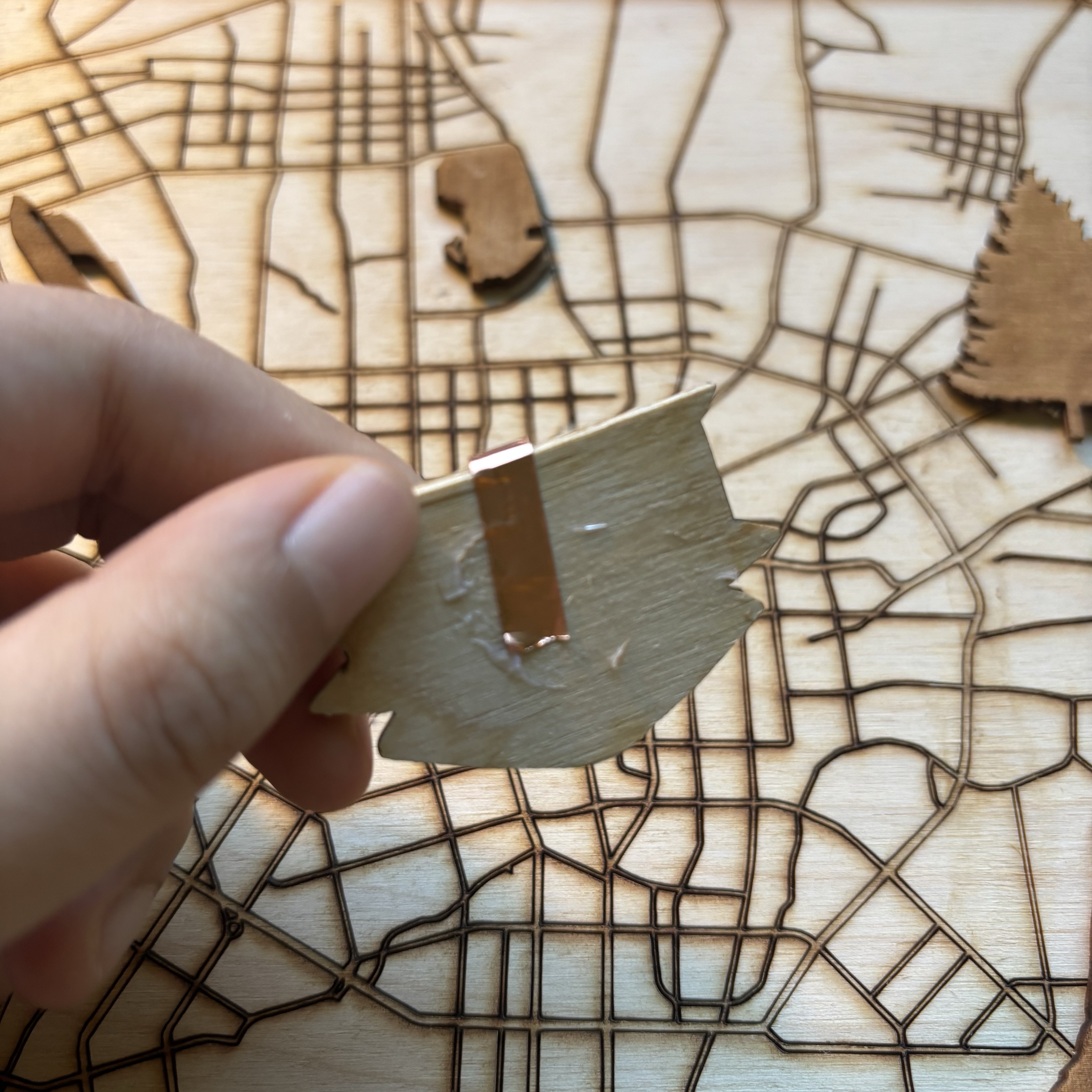 I applied copper tape to each wooden landmark to make them conductive, allowing users to trigger corresponding sounds and P5.js visual effects by touching different landmarks.