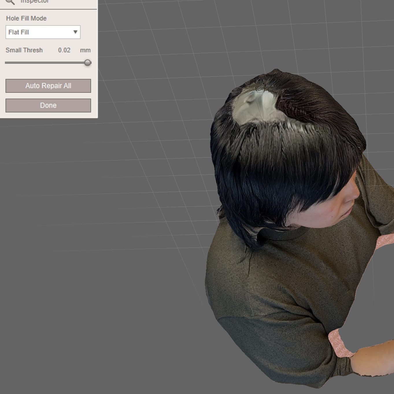 Obviously, Meshmixer doesn't do a good job of restoring the texture of the missing parts. As you can see in the picture, after completing the auto-repair, the top of my head still looks like it's missing. I wondered what the effect of this would be when imported into Cinema4D, so I didn't make any further changes.