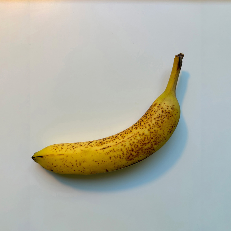 Front view of a banana. It can be seen as a combination and deformation of multiple cylinders.