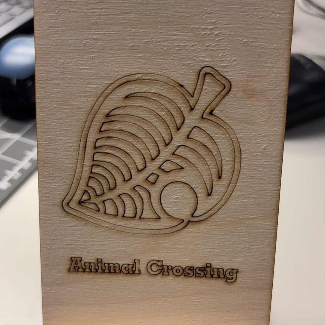 My first laser cut piece. The problem we ran into before cutting was that our file appeared very much in other colors when it was ready to be cut in the laser cutting lab. This may have been because we did not set the color of the graphic when we converted the vector graphic. As a result, the parts that were supposed to be engrave were scored.