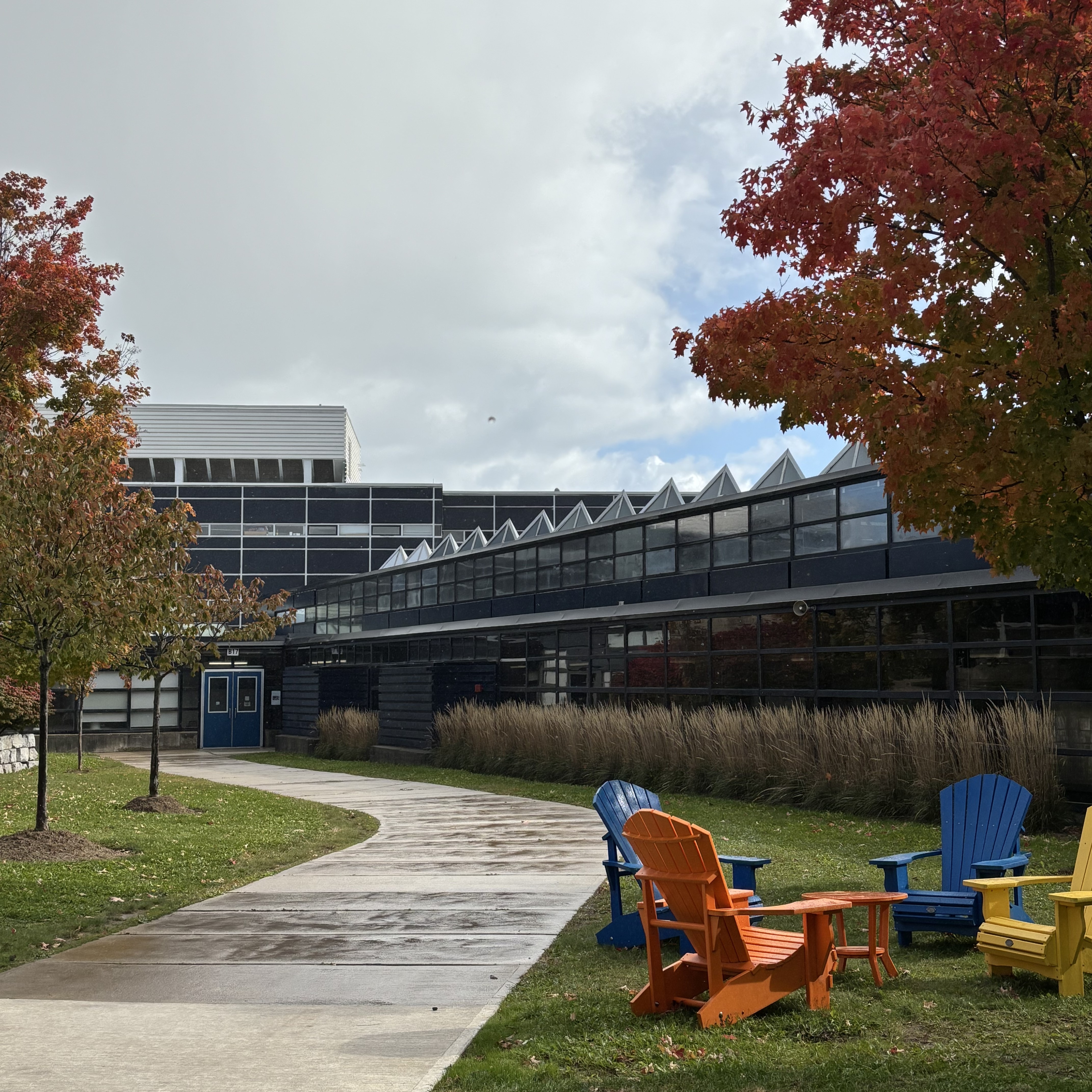 Photographing Sheridan's library from outside the building. It has a very unusual roof, made of glass and assembled in the shape of a pyramid. I'm guessing this was designed to allow for better lighting, while also highlighting the unique design and artistry.

